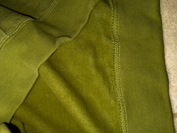 Close-up view of the soft and breathable hemp fleece texture on a men’s hoodie.